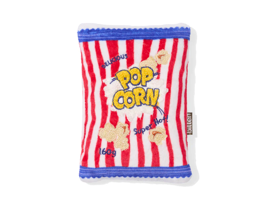 גרין קווין: כרית חימום קטנה בעיצוב שקית פופקורן בצבעים עליזים – פריט עיצובי ומרגיע לחורף